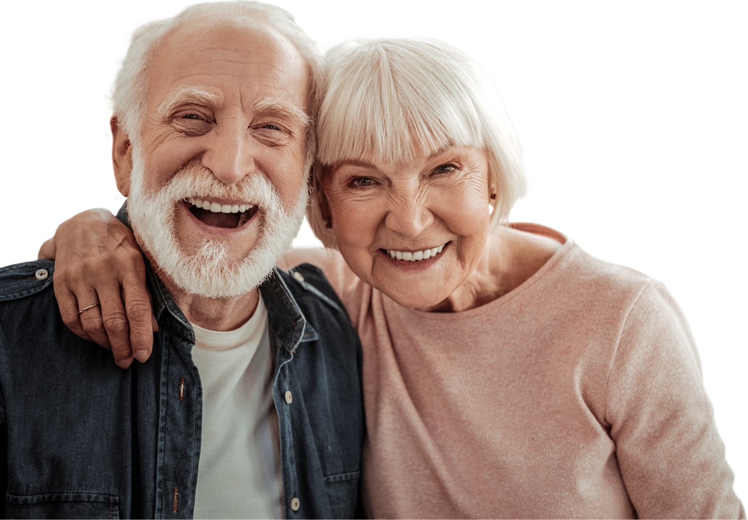 a happy elderly couple smiling and laughing at the camera